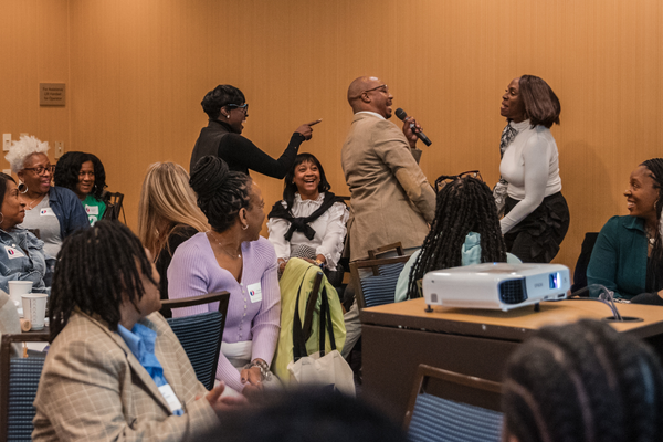 Pastor Judah Early calls on Dr. Arlonda Stevens at the Midlife Renaissance Collective's First Annual Woman Empowerment Conference.