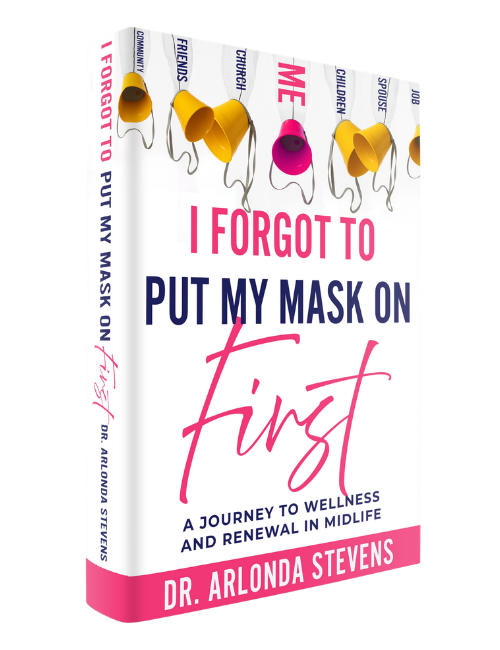 A copy of I Forgot to Put My Mask On First by Dr. Arlonda Stevens, a memoir and self-help book for middle-aged women.